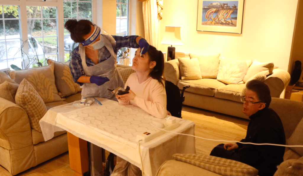 A patient recieving care from one of the HFH Healthcare team